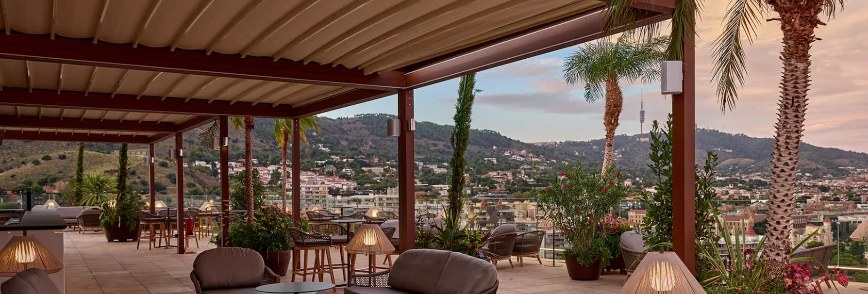 Rooftop terrace overlooking Barcelona at dusk